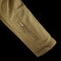 Close-up of the Condor Summit Softshell Jacket sleeve, showing a zippered pocket, stitched seam, and Velcro cuff strap for enhanced warmth and protection in cold weather.